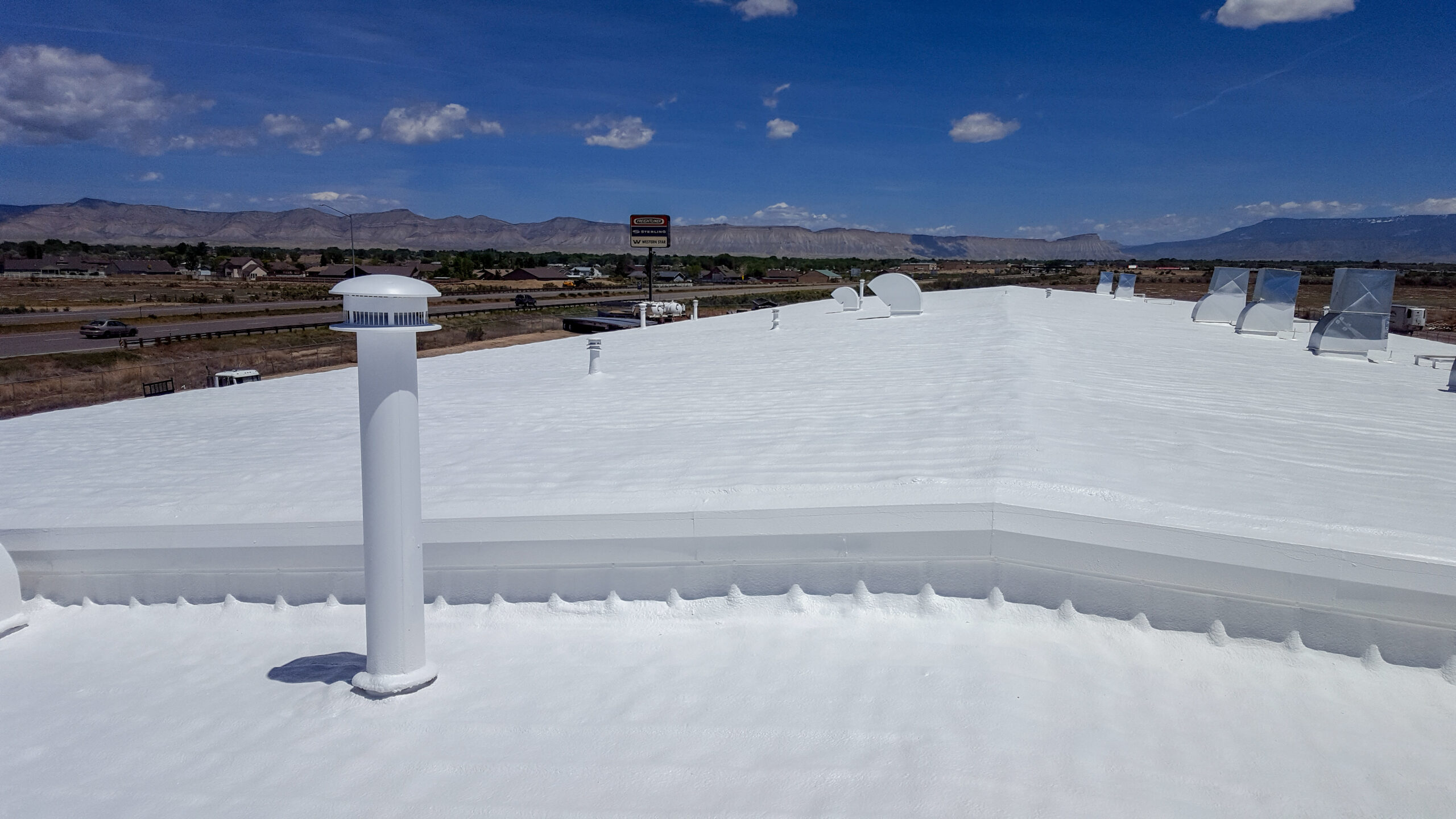 Innovative Roofing Solutions owners on a completed roof.